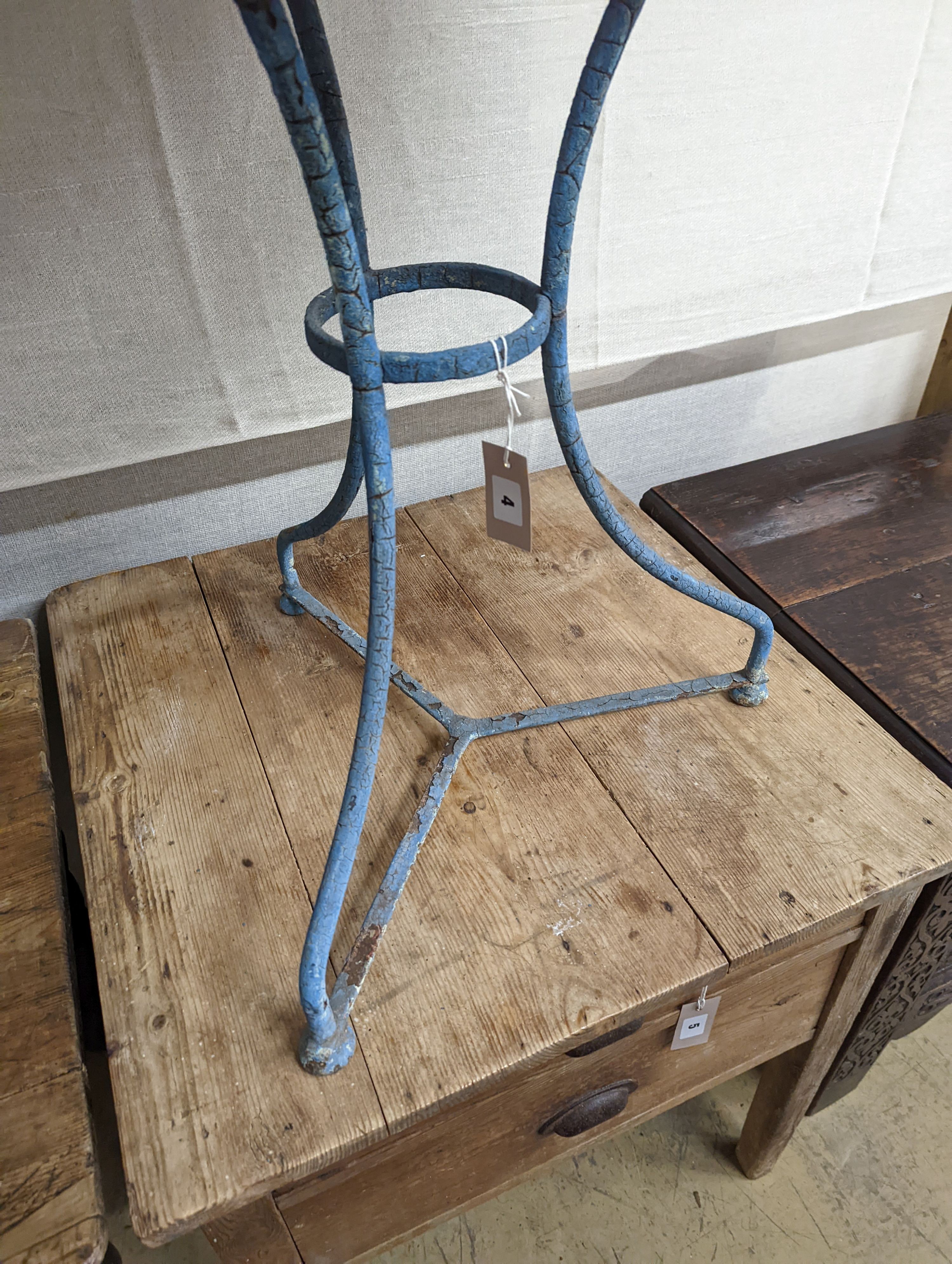 A French wrought iron garden table. W-55cm, D-55cm, H-69cm.